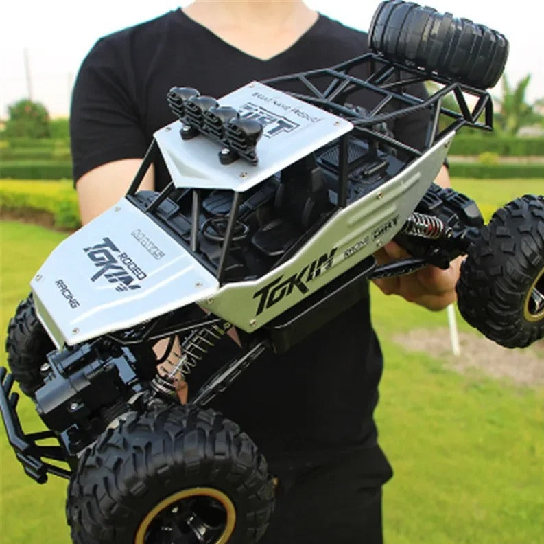 1:12 Scale Hobby-Grade Climbing Truck with 2.4GHz Radio & Shock-Absorbing Suspension for Dirt, Rocks, Grass