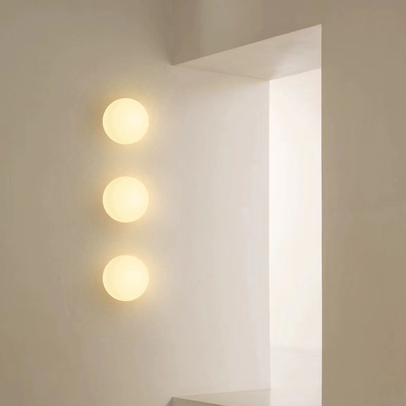 Globe Wall Light Fixture Spherical Shade Bedroom Hallway Ambient Lighting Contemporary Mount Minimal Design Clear Glass Room Accent