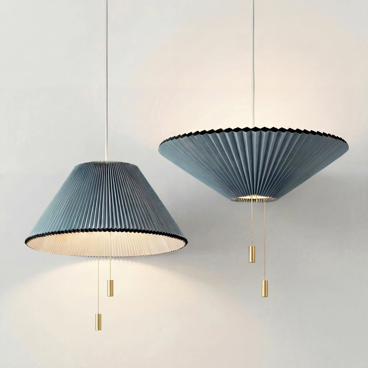 Sculptural Paper Shade Hanging Fixture with Transformable Geometry for Overhead Illumination Above Tables Islands Counters Light Blue Warm G