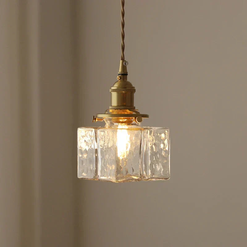 Ribbed Glass Globe Hanging Light Fixture with Brass Accents for Dining Areas and Entryways