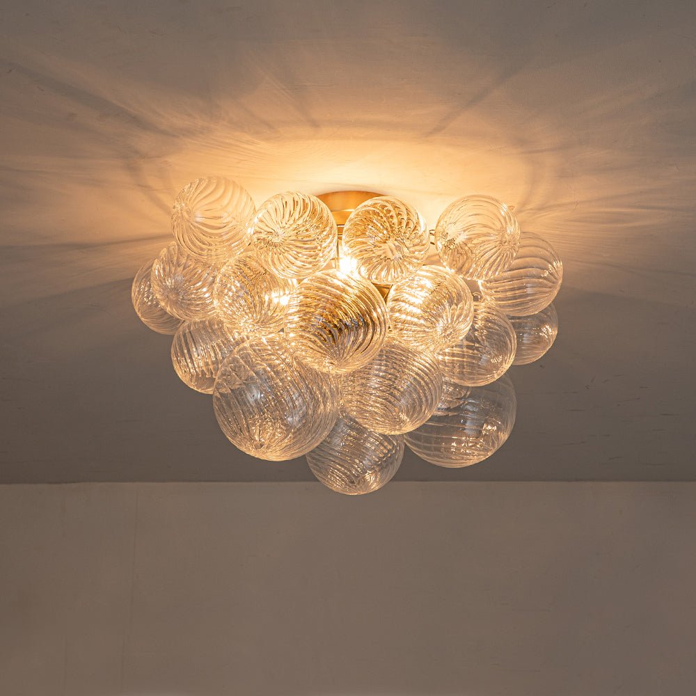 Three-Globe Ceiling Mount Fixture with Textured Glass Shades in Warm Metal Finish for Entry, Dining Room & Living Room